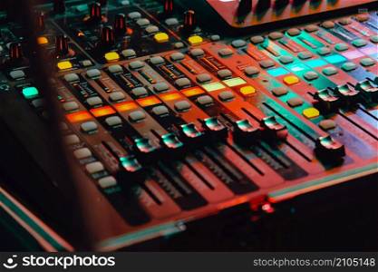 Closeup of an audio mixing control panel