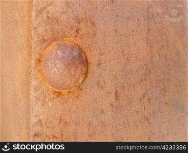 closeup of an old rusty rivet