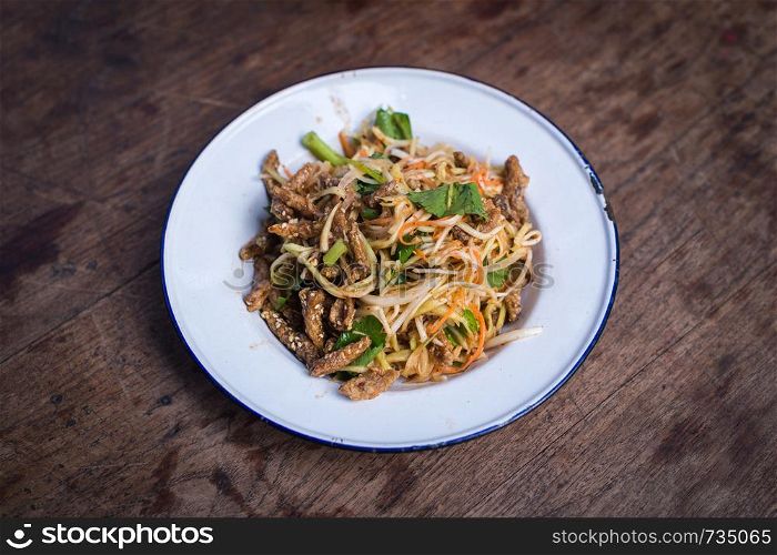 Closeup of asian food style on wooden floor