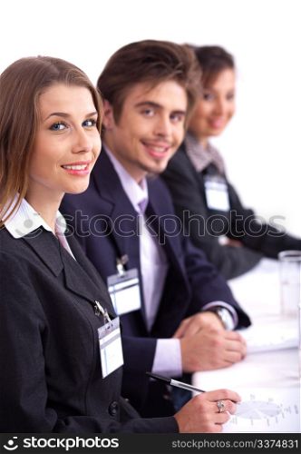 Closeup of attractive business woman with colleague in background
