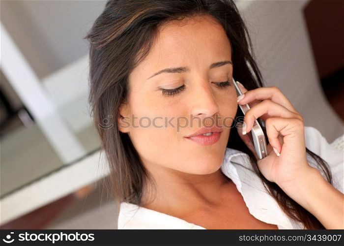 Closeup of attractive woman talking on mobile phone