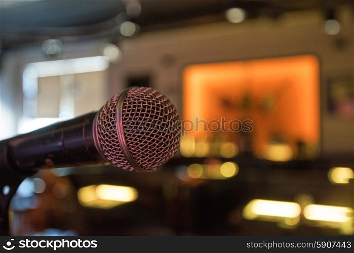 Closeup of audio microphone on stage background. microphone close up