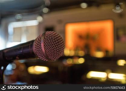 Closeup of audio microphone on stage background. microphone close up