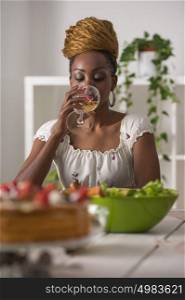 Closeup Of Beautiful African American Woman Eating Healthy Food and Drinking Wine At Home