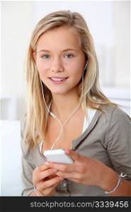 Closeup of beautiful blond girl with mobile phone