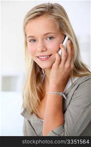 Closeup of beautiful blond girl with mobile phone