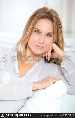 Closeup of beautiful blond woman relaxing at home