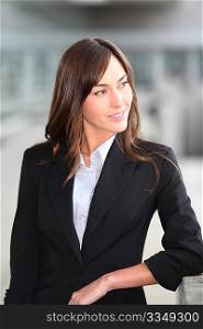 Closeup of beautiful businesswoman standing outside the office