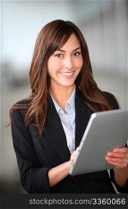 Closeup of beautiful businesswoman with electronic tablet