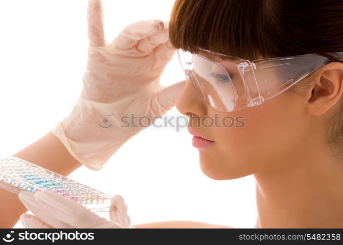 closeup of beautiful lab worker holding up reagents