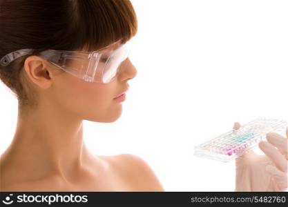 closeup of beautiful lab worker holding up reagents