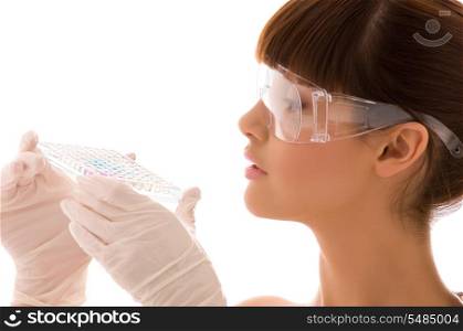 closeup of beautiful lab worker holding up reagents (focus on hands)