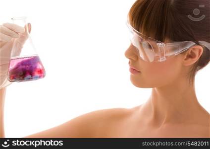 closeup of beautiful lab worker holding up test tube
