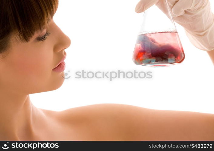 closeup of beautiful lab worker holding up test tube