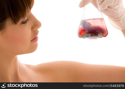 closeup of beautiful lab worker holding up test tube