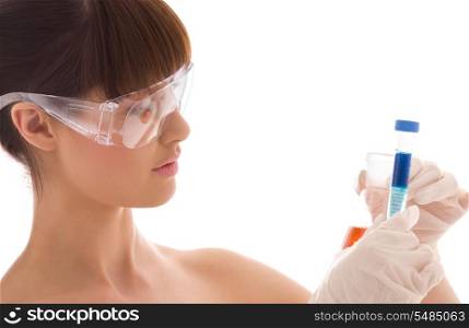 closeup of beautiful lab worker holding up test tubes