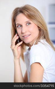 Closeup of beautiful office worker talking on the phone