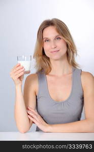 Closeup of beautiful woman drinking milk