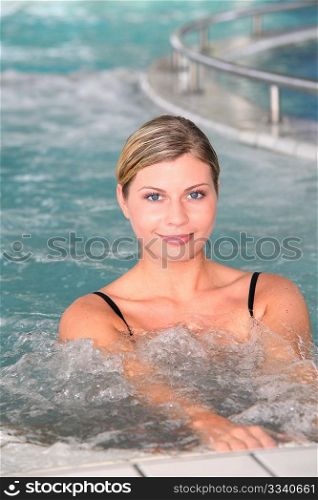 Closeup of beautiful woman in spa center