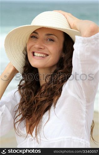 Closeup of beautiful woman wearing straw hat