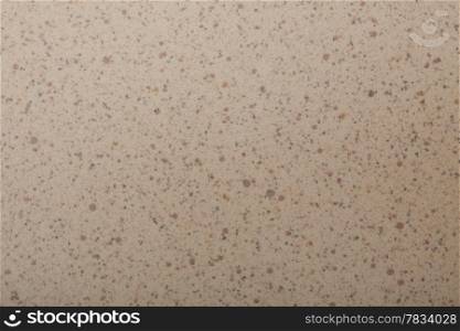 Closeup of beige brown spotted texture as background backdrop pattern