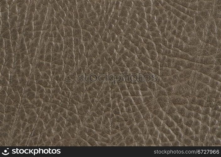 Closeup of beije leather texture background.