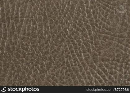 Closeup of beije leather texture background.