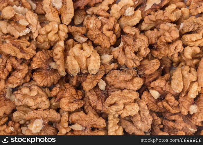 Closeup of big shelled walnuts pile. Closeup of big shelled walnuts pile, texture