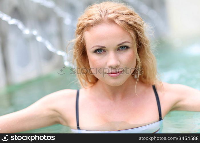Closeup of blond woman in spa pool