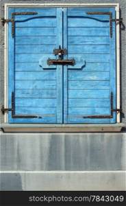 Closeup of Blue bolted shut door it blue - Locked