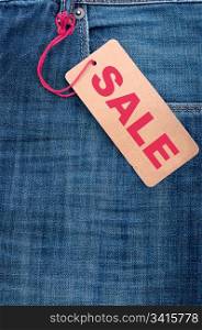 Closeup of Blue Jeans With Brown Sale Tag