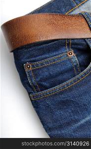 Closeup of brown belt on jeans