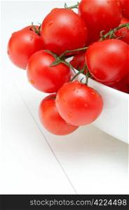 Closeup of Bunch of Fresh Cherry Tomatoes in White Bowl