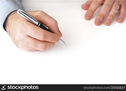 Closeup of businessman&acute;s hands on white background holding a pen