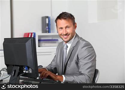 Closeup of businessman at his desk