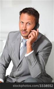 Closeup of businessman talking on mobile phone