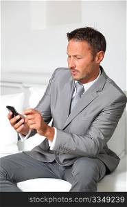 Closeup of businessman talking on mobile phone