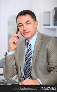 Closeup of businessman talking on the phone