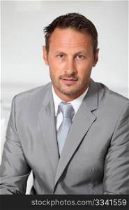 Closeup of businessman wearing grey suit