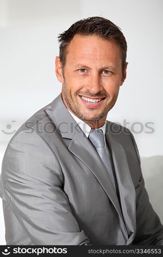 Closeup of businessman wearing grey suit