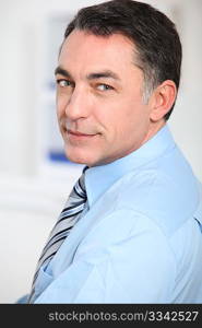 Closeup of businessman with blue shirt and tie