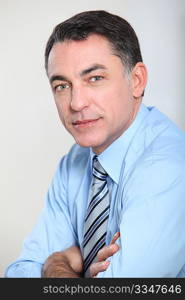 Closeup of businessman with blue shirt and tie