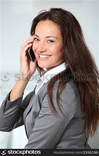 Closeup of businesswoman talking on mobile phone