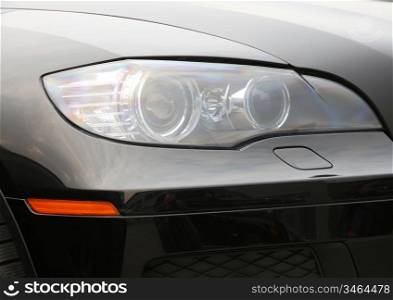 Closeup of car headlight - front view