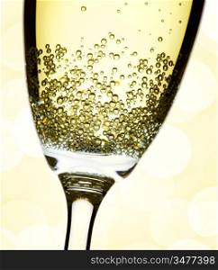 closeup of champagne flute, abstract lights background, focus on bubbles