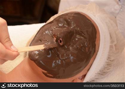 Closeup of Chocolate mask at woman face