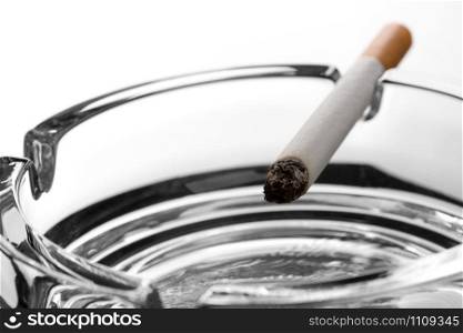 Closeup of cigarette on ashtray