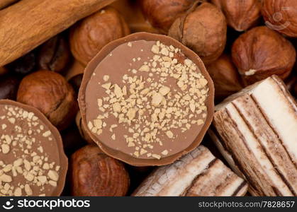 Closeup of coffee beans, cinnamon and nuts