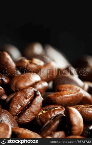 Closeup of coffee beans on black backround. Closeup of coffee beans