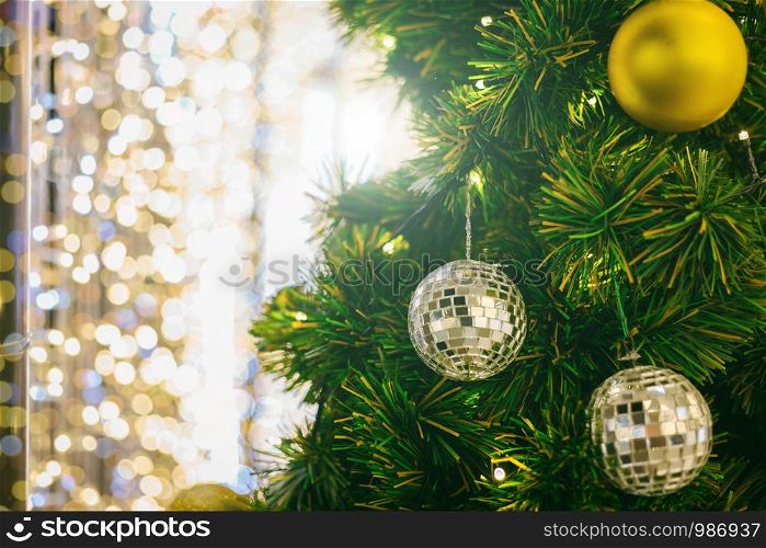 Closeup of Colorful balls on Green Christmas tree background Decoration During Christmas and New Year, bokeh lights